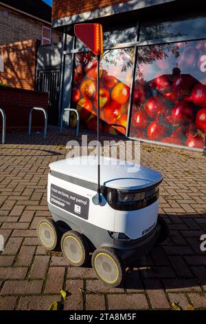 Food delivery robot UK. CoOp food delivery robot in Cambridge UK. Starship food delivery robots are used in selected towns & cities in the UK. Stock Photo