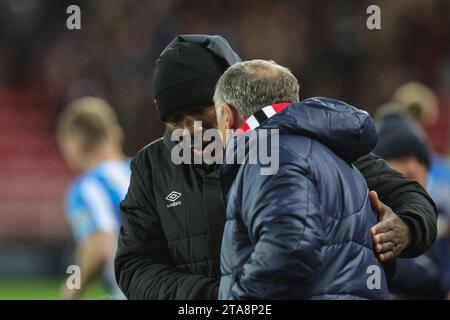 Sunderland, UK. 29th Nov, 2023. Darren Moore manager of Huddersfield Town and Tony Mowbray manager of Sunderland shake hands before the game during the Sky Bet Championship match Sunderland vs Huddersfield Town at Stadium Of Light, Sunderland, United Kingdom, 29th November 2023 (Photo by Mark Cosgrove/News Images) in Sunderland, United Kingdom on 11/29/2023. (Photo by Mark Cosgrove/News Images/Sipa USA) Credit: Sipa USA/Alamy Live News Stock Photo