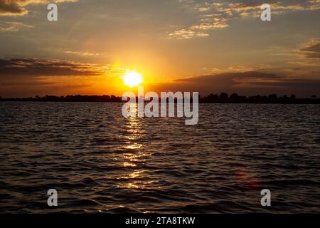 Sun setting over the Chobe river in Botswana Stock Photo