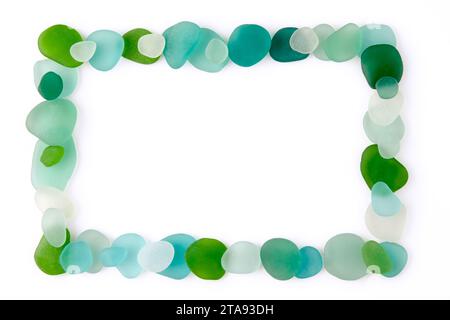 Rectangular frame laid out from blue and green glass sea pebbles and fragments of bottles polished by waves isolated on a white background Stock Photo