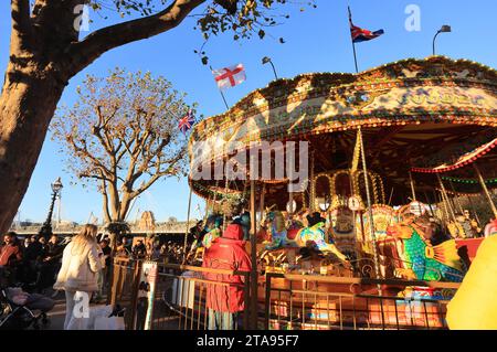 Merry-go-round, part of the Southbank Winter Market, on the banks of the River Thames, in London, UK Stock Photo