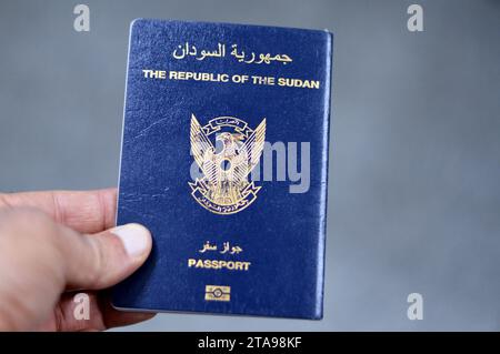 Cairo, Egypt, November 21 2023: The Republic of Sudan passport with a gilded falcon in the center of the front cover, selective focus of Sudanese pass Stock Photo