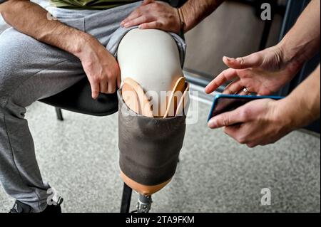Non Exclusive: ZAPORIZHZHIA, UKRAINE - NOVEMBER 17, 2023 - A prosthetic leg of serviceman Andrii is being fitted at the Prosthetics and Rehabilitation Stock Photo