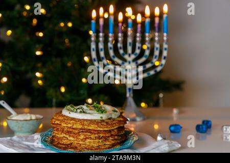 A traditional Jewish food dish, crispy potato latkes served during Hanukkah. Stock Photo