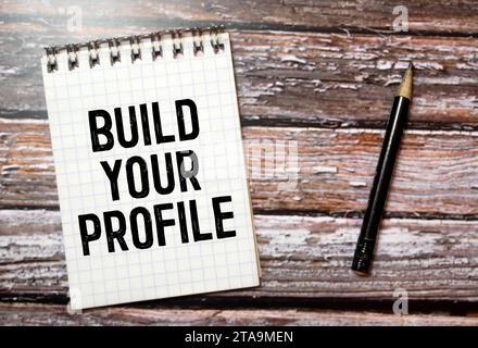 text Build your profile on torn paper, business concept. Stock Photo