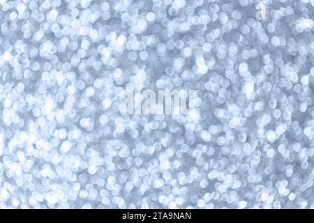 Pastel shining blue background. Christmas texture. Defocused shiny sequins. Stock Photo