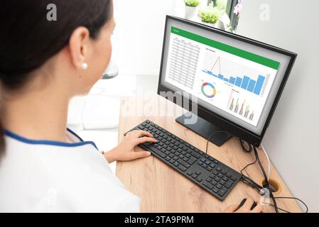 Woman analyzing data for marketing plan. Business analytics, spreadsheet Stock Photo