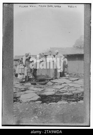 Pyeng Village well, Pyeng Yang, Korea, Photograph shows people at a well in ...