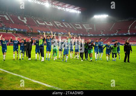 Seville, Spain. 29th Nov, 2023. PSV's players celebrates the victory after the UEFA Champions League Group B match between Sevilla FC and PSV Eindhoven in Seville, Spain, on Nov. 29, 2023. Credit: Zhang Yuheng/Xinhua/Alamy Live News Stock Photo