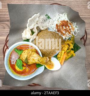 Nasi Kerabu with curry chicken, a popular traditional Malay food in Malaysia. Top view. Stock Photo