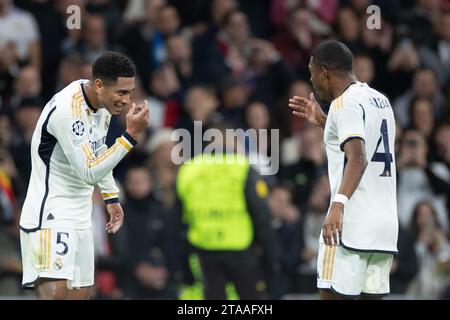 Madrid, Spain. 29th Nov, 2023. Real Madrid's Jude Bellingham (L) celebrates a goal with David Alaba during the UEFA Champions League Group C match between Real Madrid and SSC Napoli at the Santiago Bernabeu Stadium in Madrid, Spain, on Nov. 29, 2023. Credit: Meng Dingbo/Xinhua/Alamy Live News Stock Photo