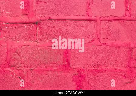 Red and pink paint on silicate blocks, brick wall, old texture, background, close-up. Stock Photo