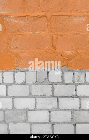 Old White Silicate Blocks Brick Vertical Wall Two Colors Orange Peach Paint Texture Background. Stock Photo