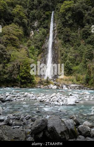 Road trip around the South Island of New Zealand. pictured at  An extremely tall and easy accessible 96-metre waterfall, Thunder Creek Falls is locate Stock Photo