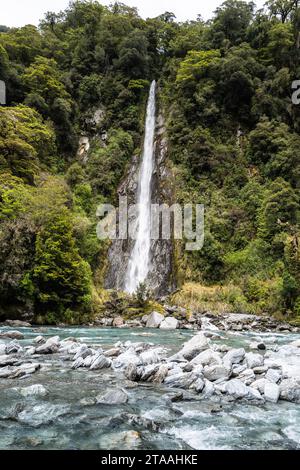 Road trip around the South Island of New Zealand. pictured at  An extremely tall and easy accessible 96-metre waterfall, Thunder Creek Falls is locate Stock Photo