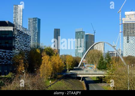 Tower blocks of Manchester city centre skyline over the Hulme Arch bridge on Princess Road, Manchester, England, UK Stock Photo