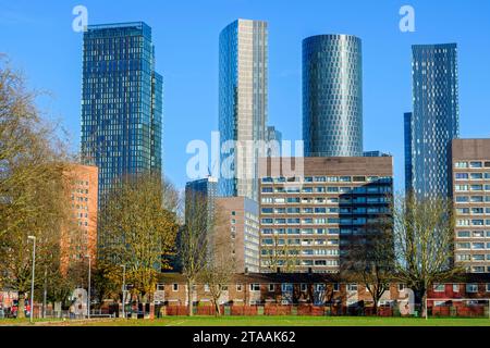 Elizabeth Tower, The Blade, the Three60, and one of the Deansgate Square apartment blocks viewed over 1960s housing, Hulme, Manchester, England, UK Stock Photo