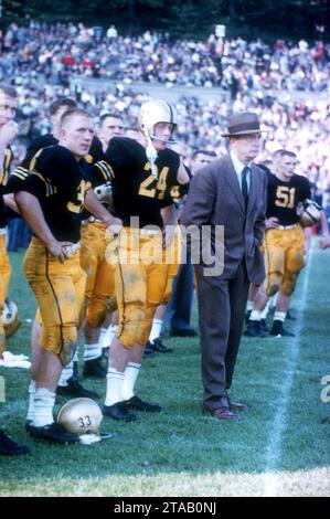 WEST POINT, NY - OCTOBER 4: Head coach Earl 'Red' Blaik, Pete Dawkins #24 and Harry Walters #33 of the Army Cadets stand on the sideline during an NCAA game against the Penn State Nittany Lions on October 4, 1958 at Michie Stadium in West Point, New York. The Cadets defeated the Nittany Lions 26-0. (Photo by Hy Peskin) *** Local Caption *** Earl Blaik;Pete Dawkins;Harry Walters Stock Photo