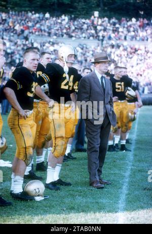 WEST POINT, NY - OCTOBER 4: Head coach Earl 'Red' Blaik, Pete Dawkins #24 and Harry Walters #33 of the Army Cadets stand on the sideline during an NCAA game against the Penn State Nittany Lions on October 4, 1958 at Michie Stadium in West Point, New York. The Cadets defeated the Nittany Lions 26-0. (Photo by Hy Peskin) *** Local Caption *** Earl Blaik;Pete Dawkins;Harry Walters Stock Photo