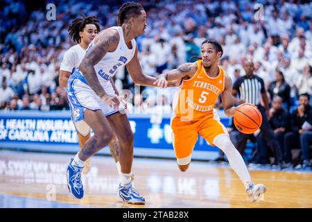 Chapel Hill, NC, USA. 29th Nov, 2023. North Carolina Tar Heels forward Armando Bacot (5) guards Tennessee Volunteers guard Zakai Zeigler (5) as he drives during the second half of the NCAA basketball matchup at Dean Smith Center in Chapel Hill, NC. (Scott Kinser/CSM) (Credit Image: © Scott Kinser/Cal Sport Media). Credit: csm/Alamy Live News Stock Photo