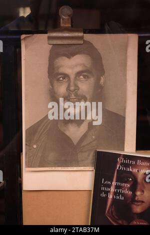 An old black and white poster of Che Guevara hanging in the window of a secondhand bookstore in San Telmo Market.Buenos Aires.Argentina Stock Photo