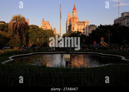 Plaza Mariano Moreno with Edificio De La Inmobiliaria building and Palacio Salvo on Avenida de Mayo in the background.Buenos Aires.Argentina Stock Photo