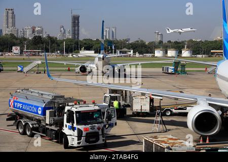 A refueling truck refueling a passenger airliner in Jorge Newbery International Airport.Buenos Aires.Argentina Stock Photo