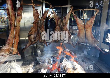 Traditional Asado- barbecue of a lamb preparing in a local restaurant.El Calafate.Argentina Stock Photo