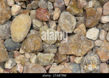 Colorful pea gravel sample small commodity style, macro details directly above. Common material for lawn replacement, garden decoration and driveways. Stock Photo