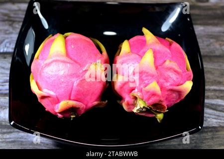 Dragon fruit, pitaya, pitahaya, fruit of the genus Selenicereus (formerly Hylocereus), both in the family Cactaceae, leather-like skin and prominent s Stock Photo