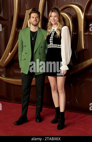 Nov 28, 2023 - London, England, UK - Joel Dommett and Hannah Cooper attending Wonka World Premiere, Royal Festival Hall Stock Photo