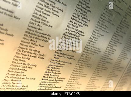 New York, USA - June 09, 2018: Name list on American Immigrant Wall of Honor is located at the Ellis Island National Museum. Stock Photo