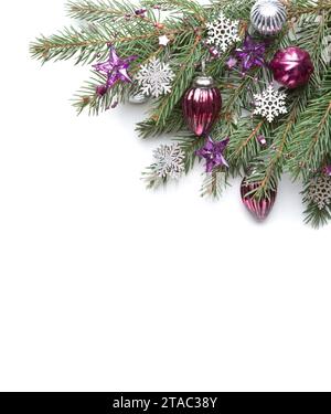 Fir branch with Christmas decorations  isolated on white  background. Stock Photo