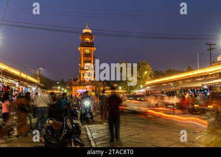 historical clock tower ancient architecture at city with crowd long exposure light trails shot image is taken at sardar market ghantaGhar jodhpur raja Stock Photo