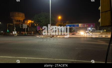 city street traffic long exposure shot with blurred light trails with at traffic control signal image is taken at sardar market ghantaGhar jodhpur raj Stock Photo