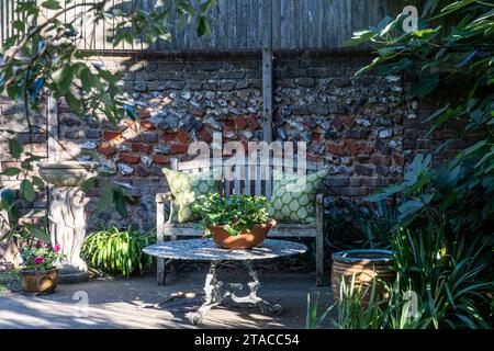 Bench and table on private terrace of 1930s Arts and Crafts style home. Hove, East Sussex, UK Stock Photo