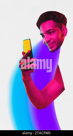 Poster. Contemporary art collage. One African American man with neon colored painted body holds smartphone against white studio background. Stock Photo