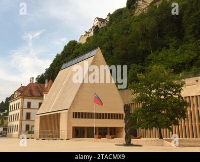 Vaduz, Liechtenstein - June 02, 2017: Liechtenstein parliament building and Gutenberg Castle at the background. Stock Photo