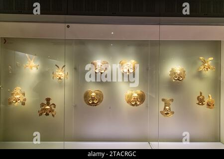 A gold mask display inside the Museo del Oro / Gold Museum in Bogotá, Colombia Stock Photo