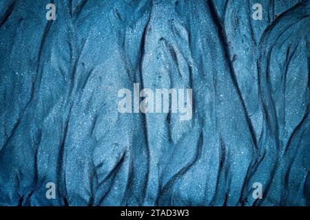 Abstract Icelandic ripple wave textured on black sand beach background Stock Photo