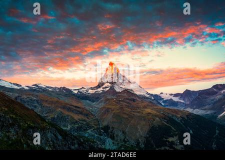 Majestic landscape of sunrise over Matterhorn iconic mountain, Swiss alps with colorful sky at Zermatt, Switzerland Stock Photo