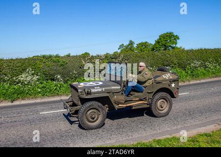 No.20584703-S Green Willys Jeep 2199cc Petrol, U.S. Army Truck, 1⁄4-ton, 4×4, Command Reconnaissance military vehicle; Vintage, restored classic motors, automobile collectors motoring enthusiasts, historic veteran cars travelling in Cheshire, UK Stock Photo