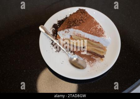 Banoffee cake with bananas and whipped cream in cafe restaurant, stock photo Stock Photo