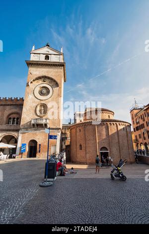 Torre dell'Orologio and Rotonda di San Lorenzo, Piazza delle Erbe, Mantua, Lombardy, Italy Stock Photo