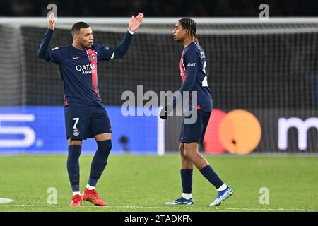 PARIS, FRANCE - NOVEMBER 28: Kylian Mbappe, Bradley Barcola of PSG celebrates after scoring a goal during the UEFA Champions League match between Pari Stock Photo