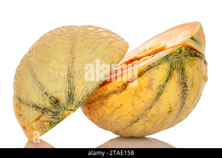 Two halves of a ripe organic melon, close-up, on a white background. Stock Photo