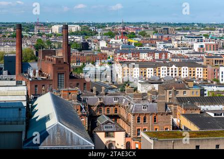 Republic of Ireland, County Dublin, Dublin, Guinness Storehouse, museum in the factory tracing the history of the famous Irish beer, view of the brewery buildings and the city, left Roe and Co distillery Stock Photo