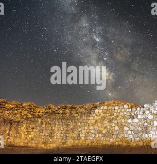 Spectacular milky way seen behind a stone wall from the castle of Atienza. Guadalajara. Spain Stock Photo