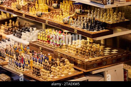 A selection of chess pieces are displayed together on shelves in Grand Bazar in Istanbul, Turkey Stock Photo
