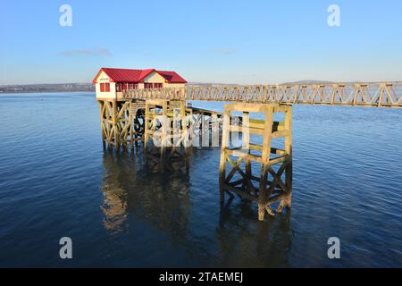 View of the original Mumbles Lifeboat station on a clear day in Mumbles in Swansea, South Wales in the UK Stock Photo